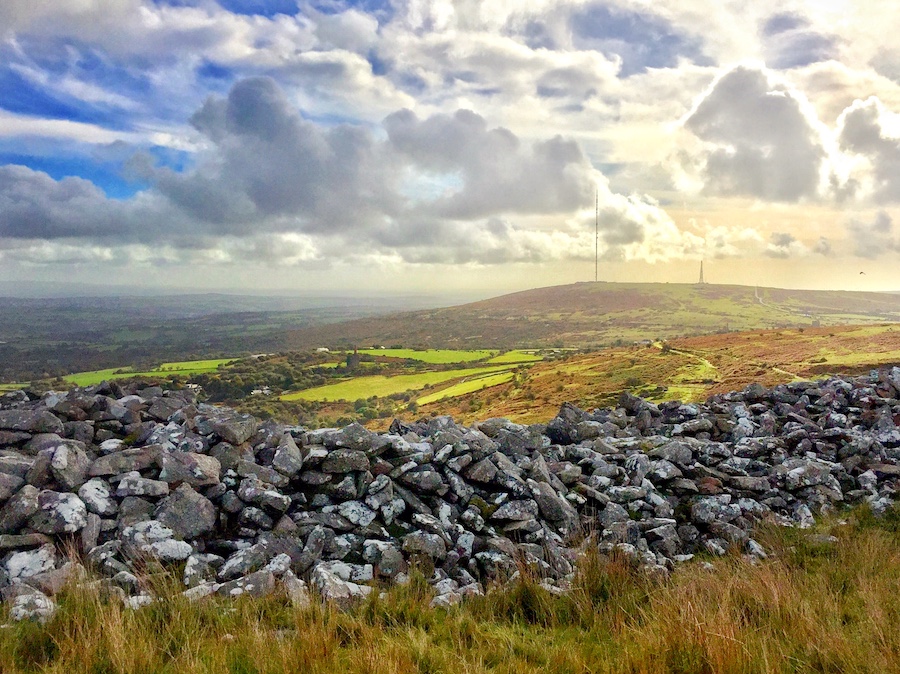 The remains of a stone walled enclosure looking out across Bodmin Moor.