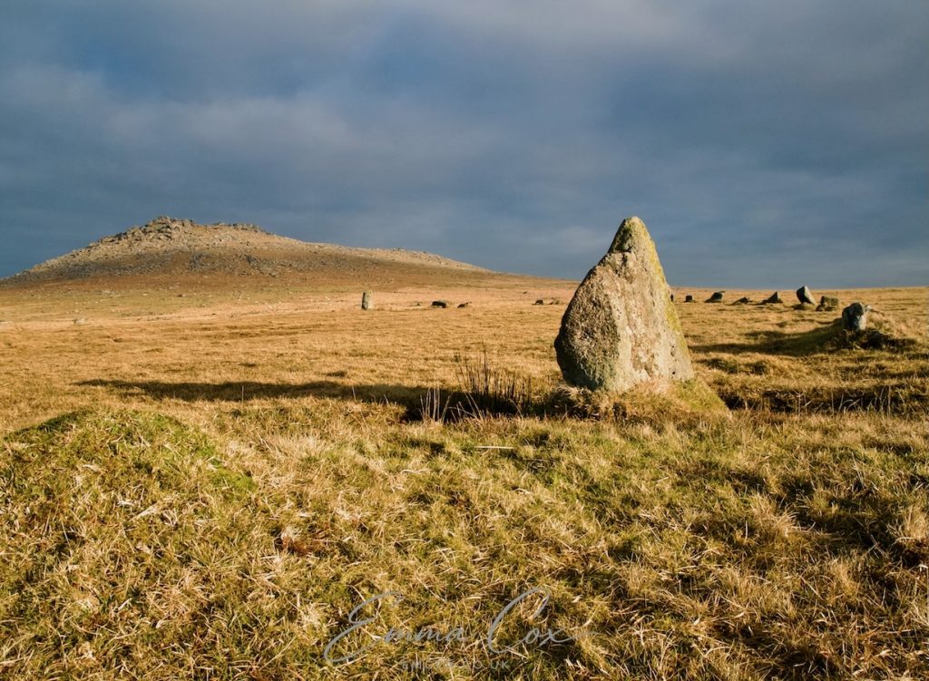 A photograph of Fernacre stone circle in view of Rough Tor, Bodmin Moor.