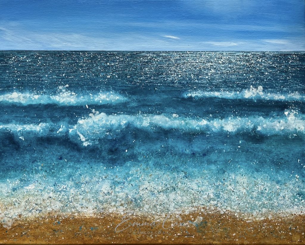 Acrylic seascape painting of the Cornish coastline, waves breaking on shore, sunlight sparkling on the sea.