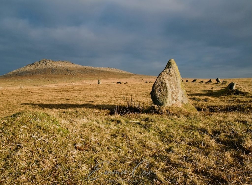 A photograph of Fernacre stone circle in view of Rough Tor, Bodmin Moor.