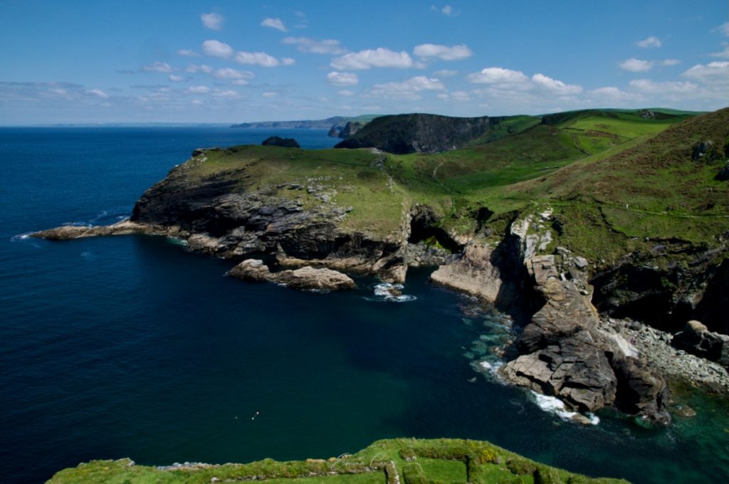 A photograph looking across a rugged headland