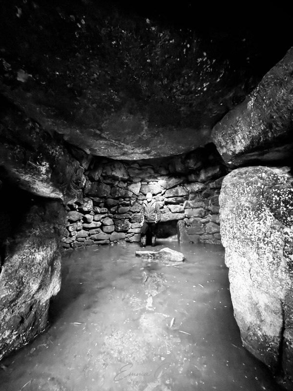 An underground round chamber lined in stone.