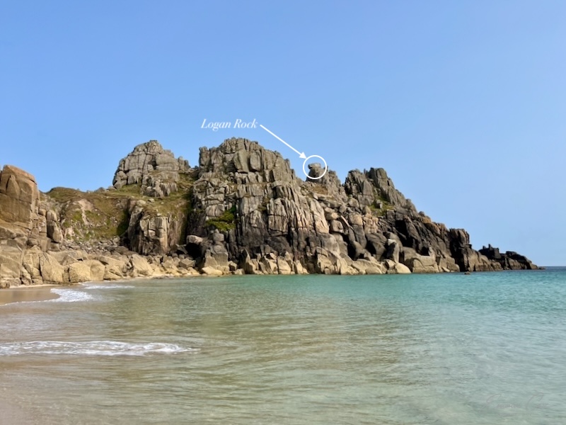Granite headland with an arrow showing Logan Rock. 