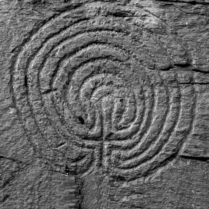 a rock carving of a maze