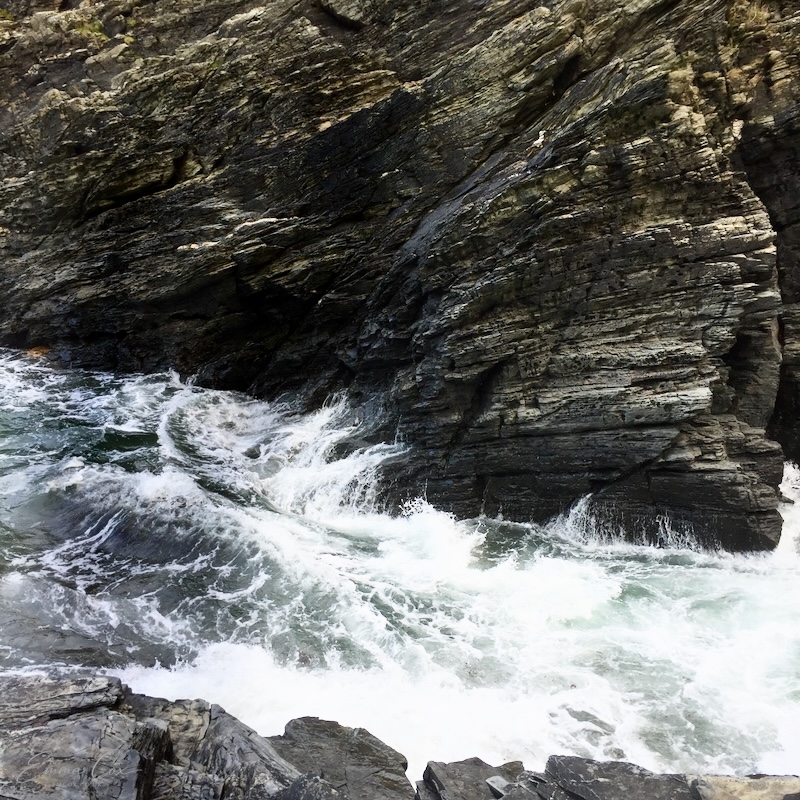 white waves against the rocks